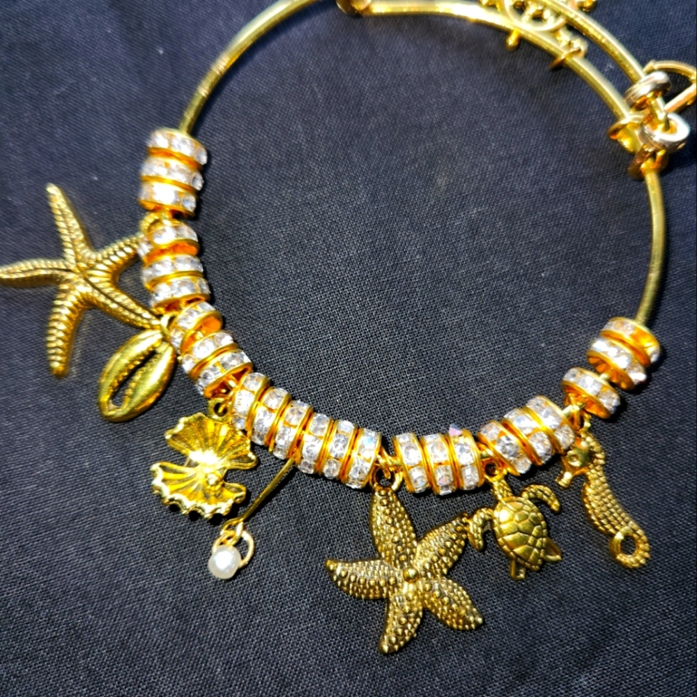 Gold bangle charm bracelet